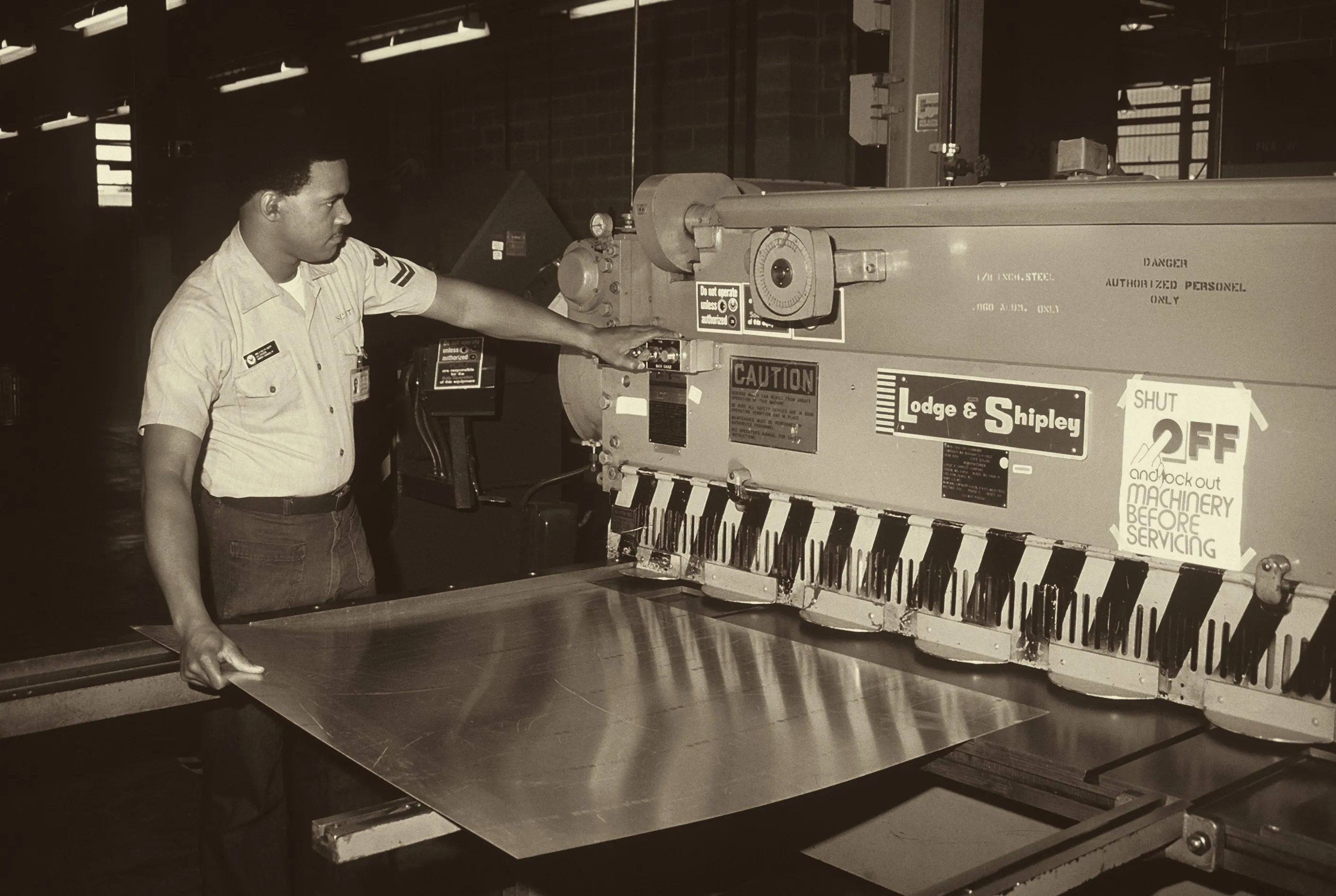 Power shear in a Navy aircraft maintenance sheet metal shop, 1987